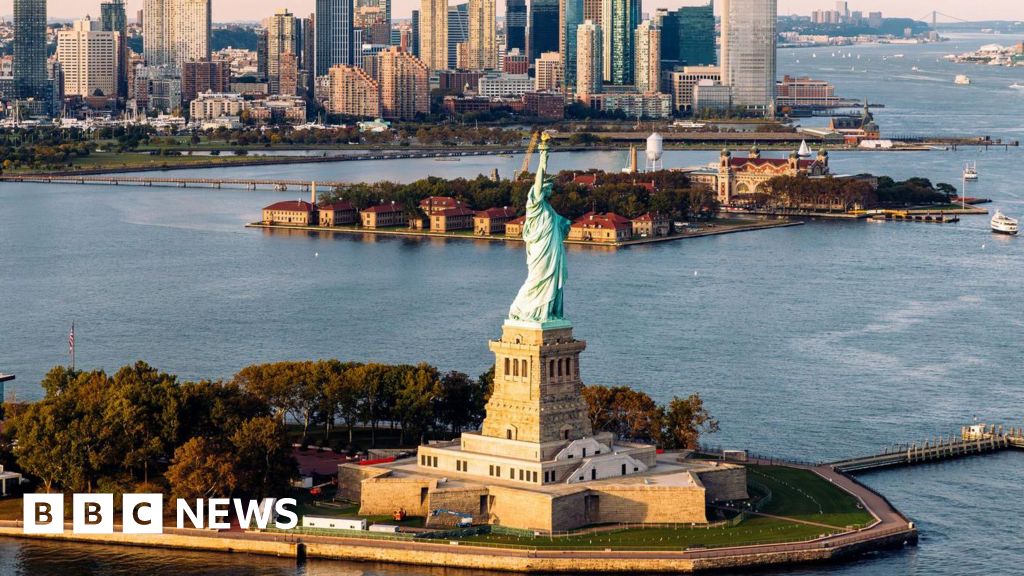 Man arrested after boat capsizes near Statue of Liberty, killing woman and infant - BBC